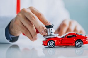 Car doctor with stethoscope in a car showroom